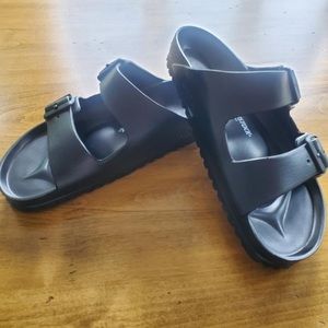 Never worn black rubber Birkenstocks.